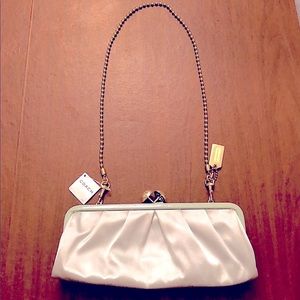 Gently used Coach clutch, sea foam blue, gold chain and clasps, seafoam blue.